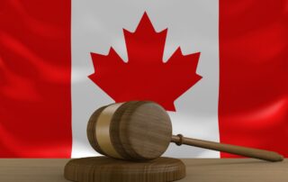 Wooden gavel with the Canadian flag.