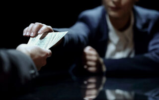 A woman accepting a bribe.