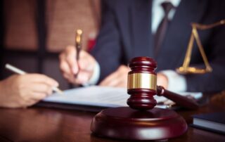Two people reviewing legal documents.