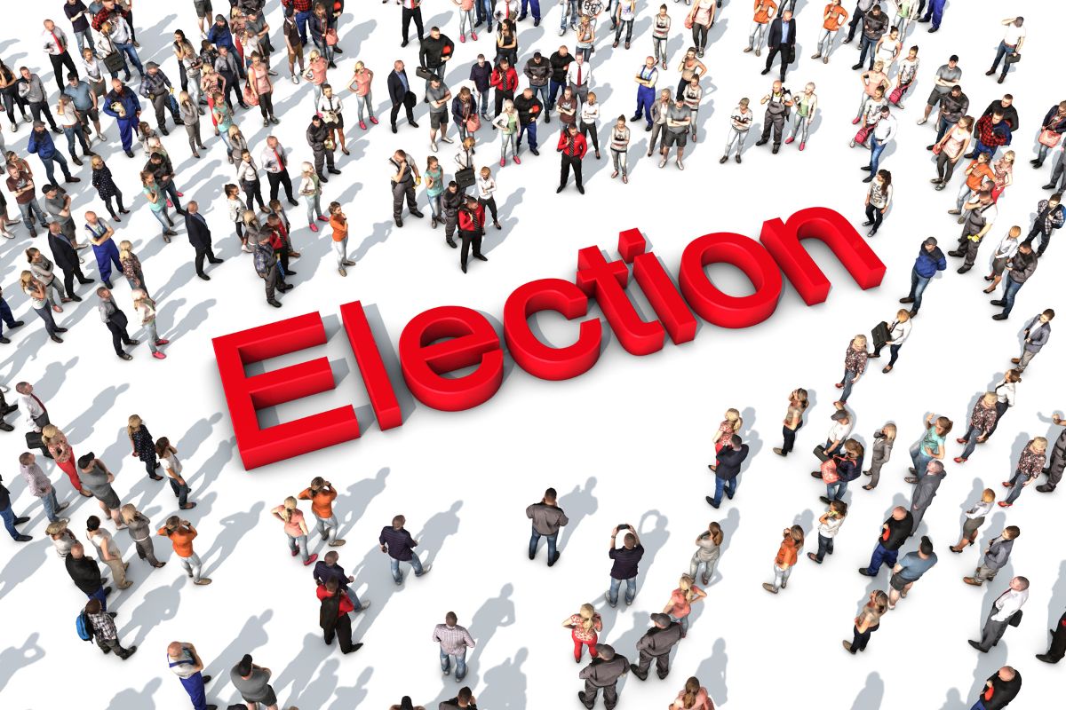A crowd of people surrounding the word “Election”. A crowd of people surrounding the word “Election”.