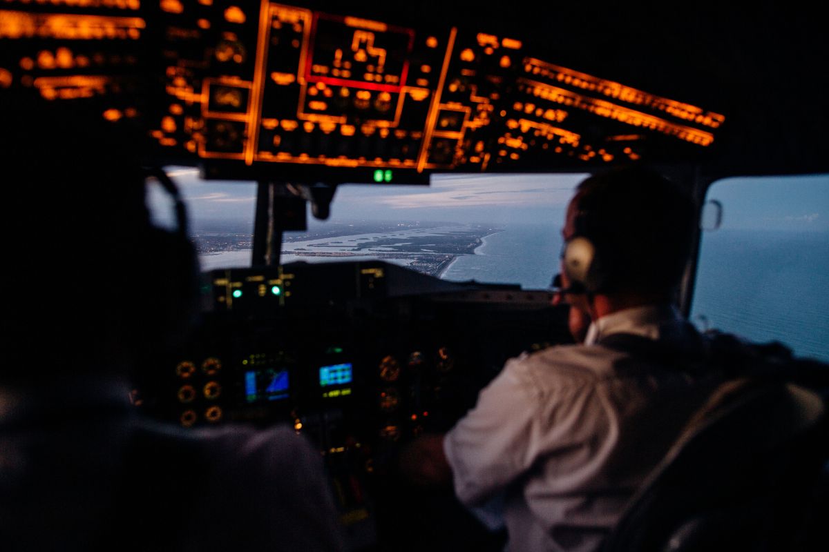 Airplane cockpit view with two pilots. Airplane cockpit view with two pilots.