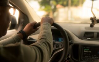 A person driving a vehicle.