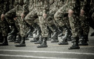 Close-up of soldiers marching in formation.