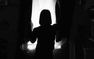 Silhouette of a woman standing.