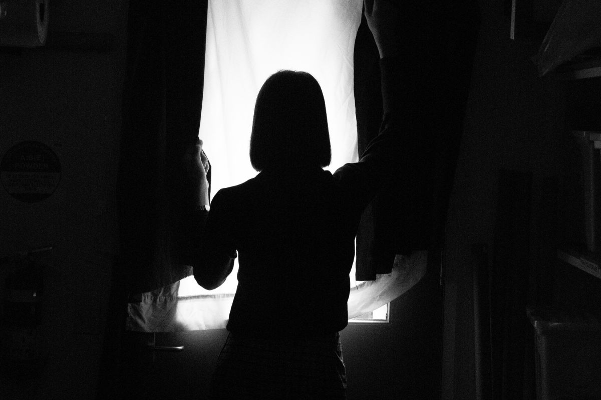 Silhouette of a woman standing. Silhouette of a woman standing.