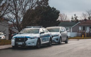 Police car parked near a private property sign.