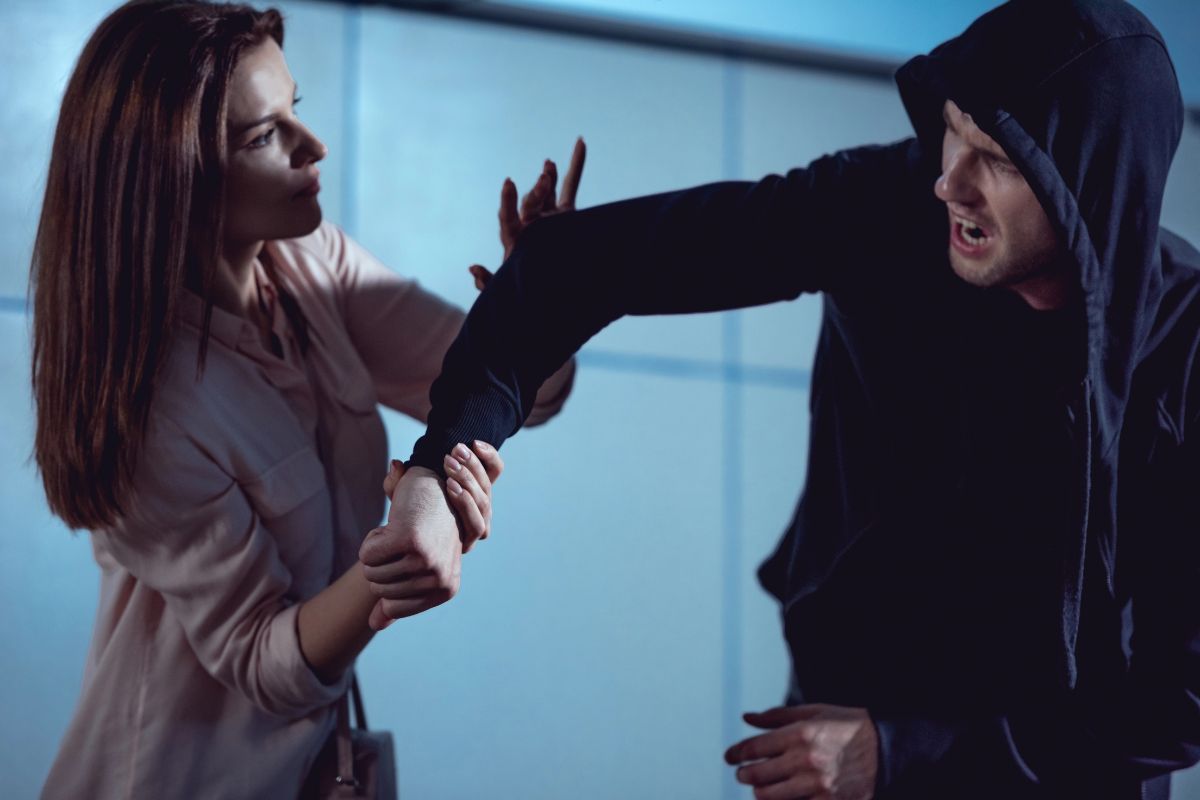 A woman defending herself from an aggressive man. A woman defending herself from an aggressive man.