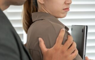 An adult inappropriately touching a teenager