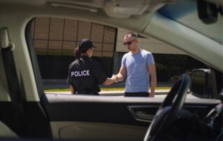 Police officer speaking with a man.