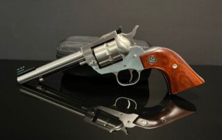A handgun with a wooden grip.
