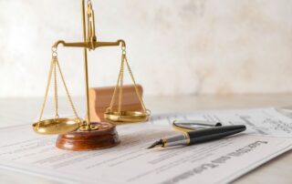 Scales of justice with documents and papers.