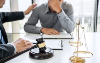 Concerned client meeting with lawyer about false criminal accusation.