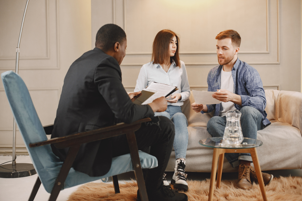 Teen talking to counselor. Teen talking to counselor.